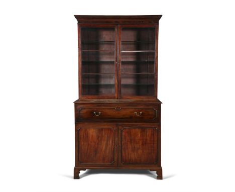 A GEORGE IV MAHOGANY SECRETAIRE BOOKCASEthe glazed panel doors above a fall front writing section and cupboard base on bracke