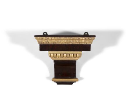 A SMALL WALNUT AND PARCEL GILT RECTANGULR WALL BRACKET,29cm wide, 26cm high, 20cm deep.