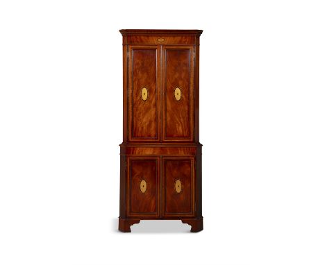 AN INLAID MAHOGANY CORNER CABINETthe outset cornice with dentil frieze over twin fielded cupboard doors inset with cartouches
