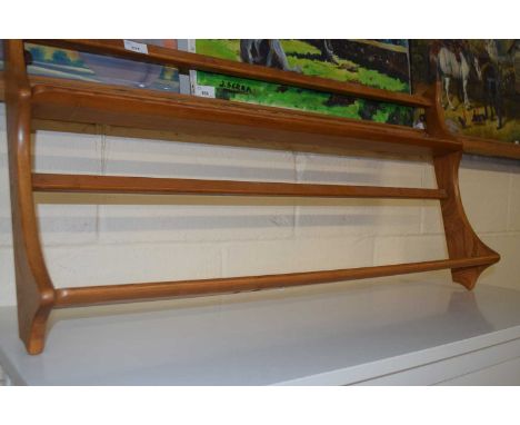 An Ercol light elm wall shelf, 96cm wide
