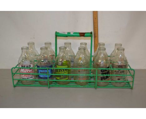 A crate of vintage milk bottles