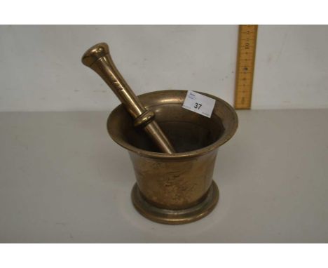 A vintage brass pestle and mortar