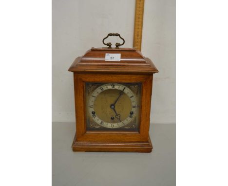 A 20th Century Elliott mantel clock in hardwood case bearing Manchester retailers stamp