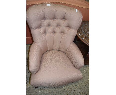 A Victorian style button back armchair