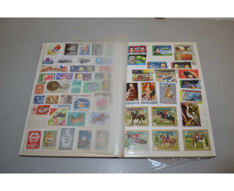 A stock book of various world stamps, first day covers and various loose