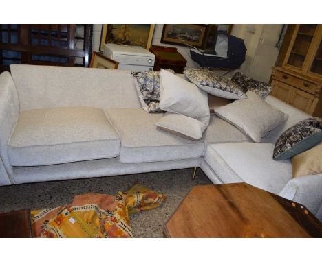 A modern corner sofa with scatter cushions, 270cm long maximum