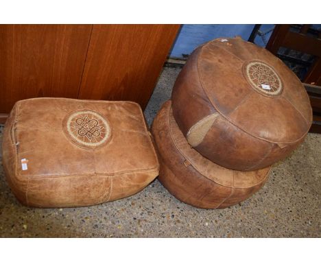 A pair of vintage circular leather covered pouffe together with a rectangular leather covered pouffe (Item 28 on vendor list)