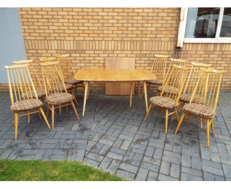 Ercol - An extending dining table with ten Goldsmith chairs, table 71 cm x 90 cm x 150 (222 when extended) cm.

Condition Rep