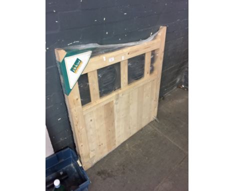 A WOODEN GARDEN GATE