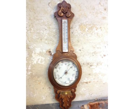 An oak barometer. L89cm.