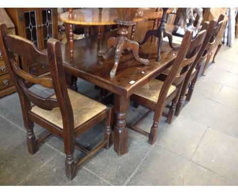 A large oak refectory table and six chairs. Table L208cm D89cm H75cm Chairs W52cm D55cm H107cm.