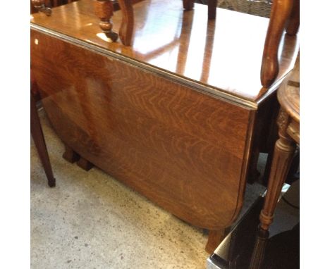 An oak drop leaf table.