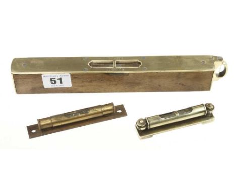 A surveyors sighting level and plumb by D LYON, London and two small brass levels with rolling protector covers G