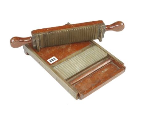 A mahogany and brass pill roller c/w tray G+