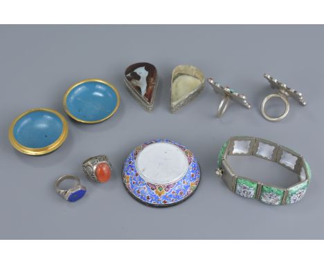 A group of seven items including a cloisonné box and cover, painted enamel bracelet with small dish and another box and cover