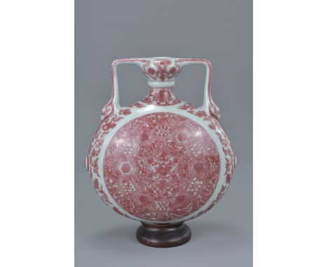 Chinese Porcelain Copper Red Moon Flask (damage to base) with a wooden stand, 19cms total height