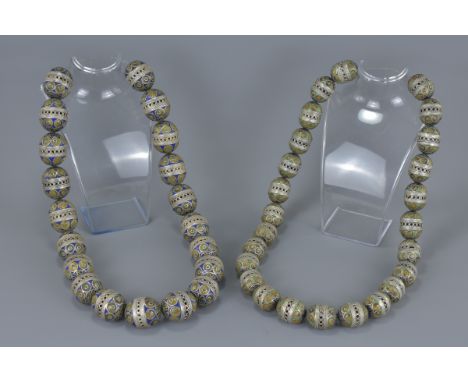 Two groups of large Africa Moroccan white metal and coloured enamel beads. 3cm and 4cm length (2)
