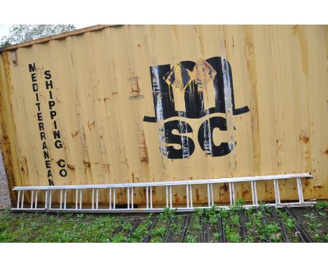 AN ALUMINIUM DOUBLE EXTENSION LADDER 400cm long closed with wheels on one section
