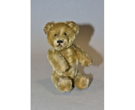 AN UNMARKED TEDDY BEAR PERFUME BOTTLE, possibly Schuco jointed golden mohair body with removable head, metal pin eyes, horizo