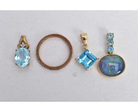 THREE 9CT GOLD GEM SET PENDANTS AND A YELLOW METAL FULL ETERNITY RING, the first pendant set with an oval opal triplet, withi