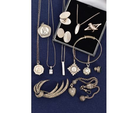 A SELECTION OF SILVER AND WHITE METAL JEWELLERY, to include a silver Victorian pendant of a circular form decorated with a ye