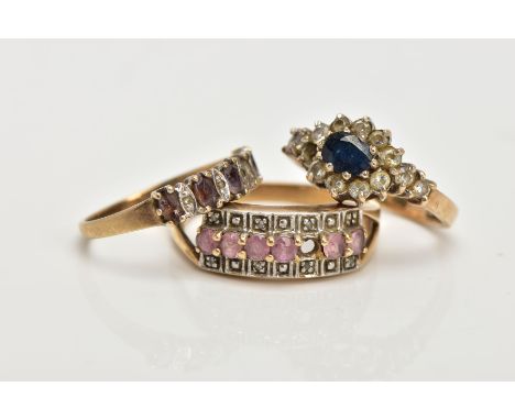 THREE 9CT GOLD GEM SET RINGS, the first a sapphire and paste cluster ring, ring size J, the second designed as a row of ameth