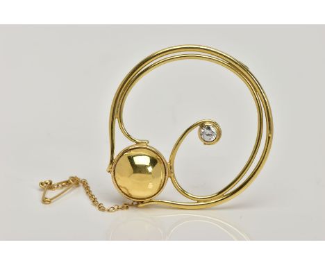 AN 18CT GOLD DIAMOND BROOCH, of an openwork and scroll design, set with a round brilliant cut diamonds, collet mounted, total
