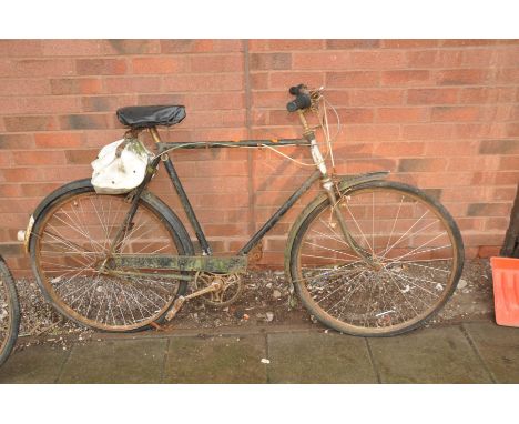 A VINTAGE TRIUMPH GENTS BIKE with three speed gears, 23in frame (distressed)