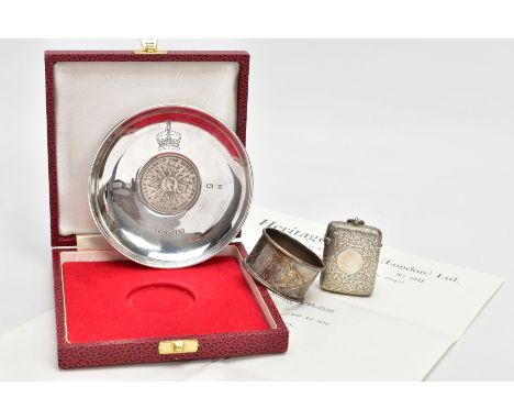 A SILVER ‘QUEEN MOTHER CROWN DISH’, NAPKIN RING AND A VESTA, the cased silver dish inset with a silver crown commemorative co