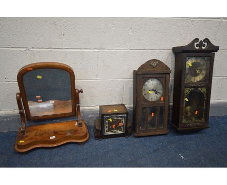 A VICTORIAN FLAME MAHOGANY SWINGING DRESSING MIRROR, along with two wall clocks and an Art Deco mantel clock (4)