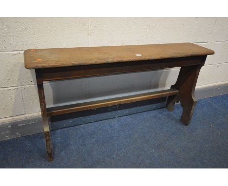 AN EARLY 20TH CENTURY OAK ECCLESIASTICAL BENCH, width 124cm x depth 27cm x height 65cm (condition:- fluid stains, a part to t