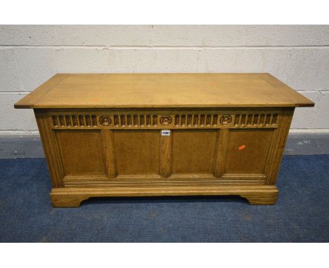 A 20TH CENTURY LIGHT OAK BLANKET BOX, with four panels on bracket feet, width 107cm x depth 43cm x height 49cm