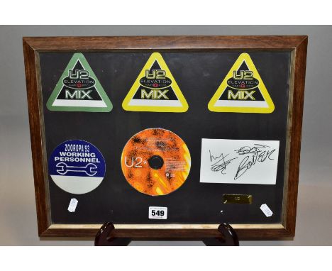 U2 MUSIC MEMORABILIA, comprising framed three Elevation tour patches, Zooropa tour patch, U2 CD and card bearing signatures, 