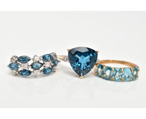 THREE 9CT GOLD GEM SET DRESS RINGS, the first a 9ct white gold ring set with blue and colourless topaz, hallmarked 9ct gold B