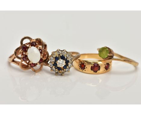 FOUR 9CT GOLD GEM SET RINGS, to include a sapphire and cubic zirconia cluster ring, a cross over peridot ring, a three stone 