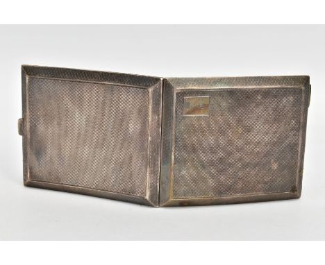 A SILVER CIGARETTE CASE, of a rectangular form, engine turned design with an engraved monogram, opens to reveal a gilt interi