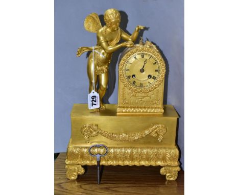 A CHAPPE OF PARIS GILT METAL MANTLE CLOCK, the rectangular base is surmounted by a fairy holding a flower to a pendulum opera