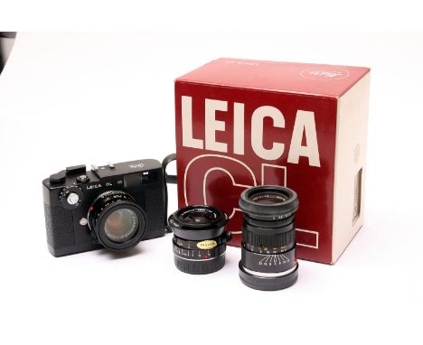 A Leica CL Rangefinder Camera, with Leitz Summicron-C f/2 40mm, Minolta M-Rokkor f/2.8 28mm, and Leitz Elmar-C f/4 90mm lense