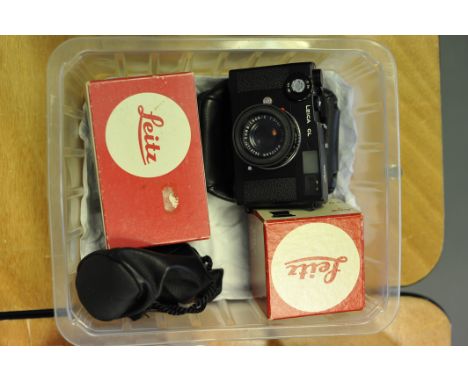 A Leica CL Rangefinder Camera, with various Leitz lenses including Summicron-C f/2 40mm, Summicron-M f/2 50mm, and Summicron-