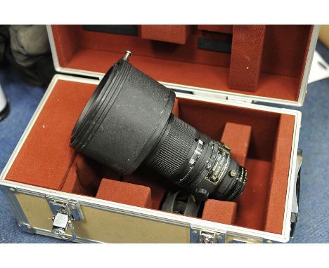 Nikon ED f/2.8 300mm Lens, auto focus model with maker's hood and trunk case, a/f