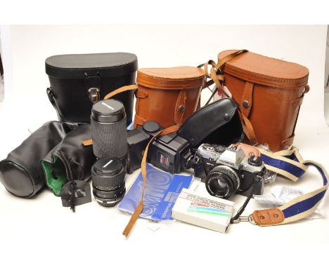 An Olympus OM-10 SLR Camera, together with various lenses and binoculars (a lot)