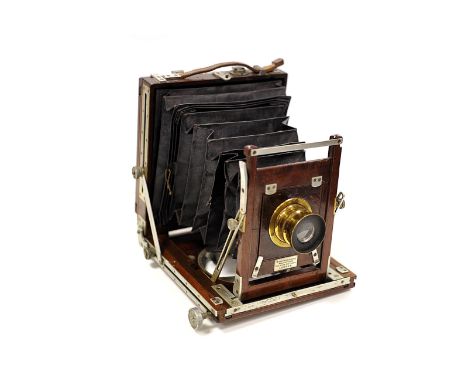 A W. Watson & Sons Half Plate Mahogany Camera, with aluminium fittings, together with Beck Symmetrical f/8 brass lens