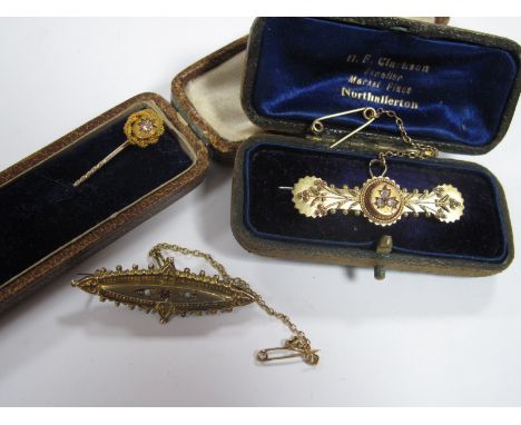 A Victorian Diamond Set Bar Brooch, of foliate design, stamped "15ct"; together with a stick pin, diamond set oval highlight,