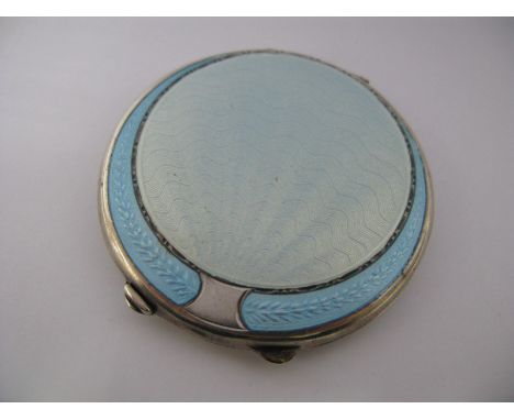 A Hallmarked Silver and Pale Blue Enamel Circular Ladies Compact (lacking puff).