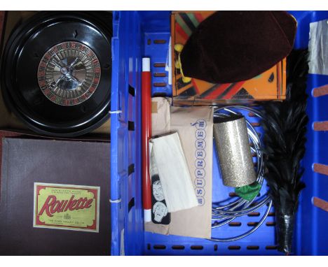 A Mid XX Century Roulette Wheel by Chad Valley, boxed and a quantity of magic tricks including rings.