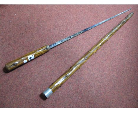 A Sword Stick, with blue floral decoration to lozenge shaped silvered blade 68.5cm long, with knopped wooden handle and sheat