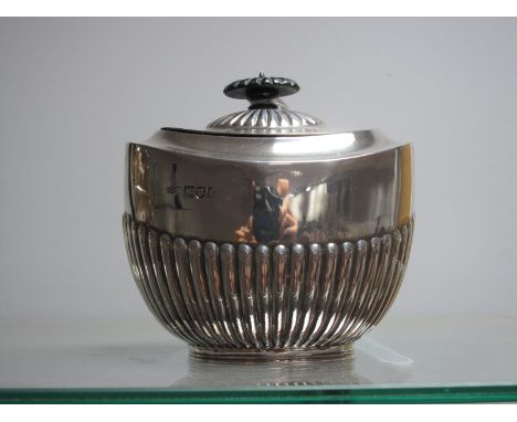 A Hallmarked Silver Lidded Sugar Bowl/Caddy, Messrs Hutton, London 1902 of oval semi reeded form.