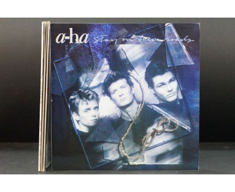 Vinyl - 2 A-Ha! LP, 3 12", and 2 sleeve mock-ups to include Stay On These Roads (promo stickered), Hunting High &amp; Low, Hu