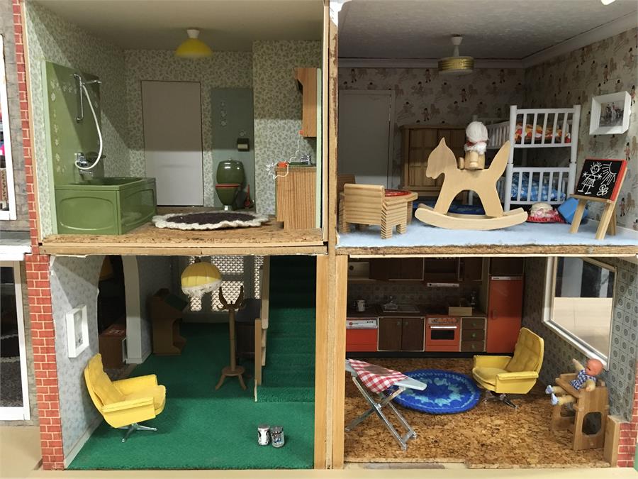 A handmade wooden doll's house, 1970's/'80s style, fitted with