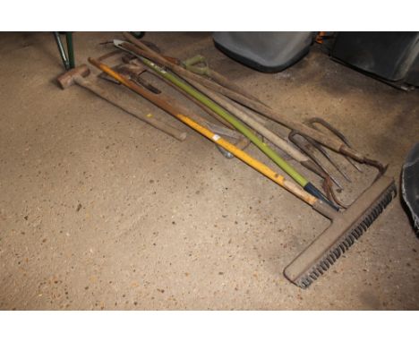A quantity of long handled gardening tools 
